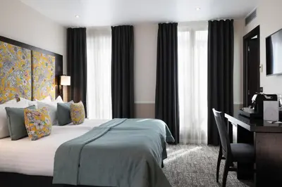 Un ou plusieurs lits dans un hébergement de l'établissement Hotel Park Lane Paris