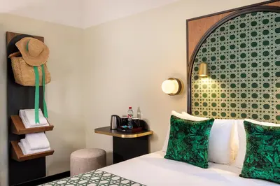 Un ou plusieurs lits dans un hébergement de l'établissement Hotel Lejolly - ex Avalon Cosy