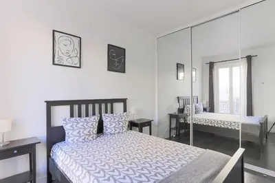 Un ou plusieurs lits dans un hébergement de l'établissement Champs de Mars Appartement