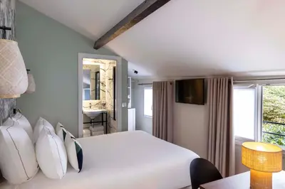 Un ou plusieurs lits dans un hébergement de l'établissement Hôtel La Canopée