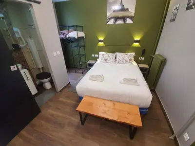 Un ou plusieurs lits dans un hébergement de l'établissement HOTEL SAVOY