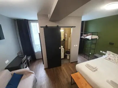 Un ou plusieurs lits dans un hébergement de l'établissement HOTEL SAVOY
