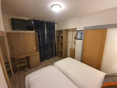 Un ou plusieurs lits dans un hébergement de l'établissement HOTEL SAVOY
