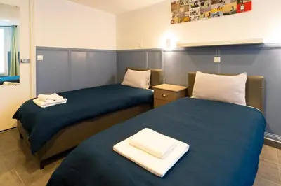 Un ou plusieurs lits dans un hébergement de l'établissement Hotel Geoffroy Marie Opéra