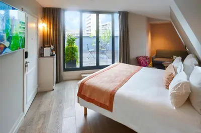 Un ou plusieurs lits dans un hébergement de l'établissement Hôtel Vic Eiffel