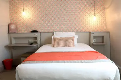 Un ou plusieurs lits dans un hébergement de l'établissement Hôtel Vic Eiffel