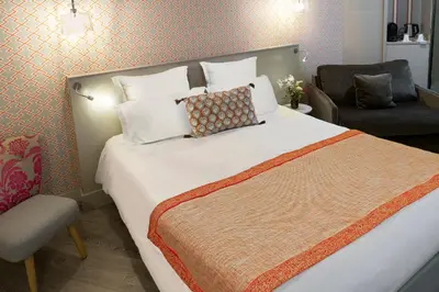 Un ou plusieurs lits dans un hébergement de l'établissement Hôtel Vic Eiffel