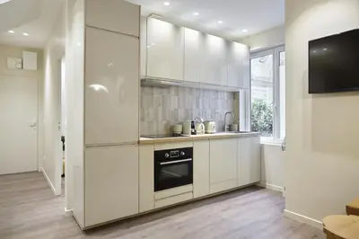 Cuisine ou kitchenette dans l'établissement Residence Le Marais Beaubourg by Studio prestige