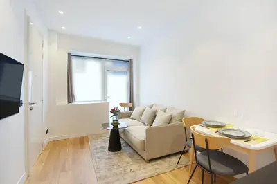 Télévision ou salle de divertissement dans l'établissement Residence Le Marais Beaubourg by Studio prestige