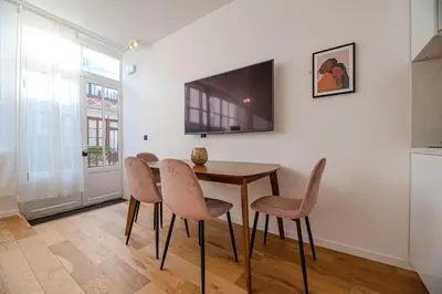 Télévision ou salle de divertissement dans l'établissement MBM - LOFT MARAIS