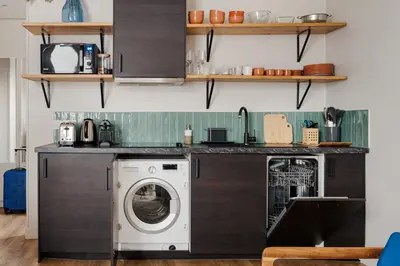 Cuisine ou kitchenette dans l'établissement Edgar Suites Grands Boulevards - Boulanger