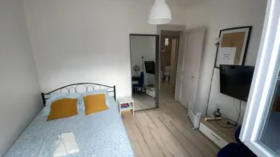 Un ou plusieurs lits dans un hébergement de l'établissement Studio Montmartre 15 min du Sacré-Cœur, cosy & chauffé