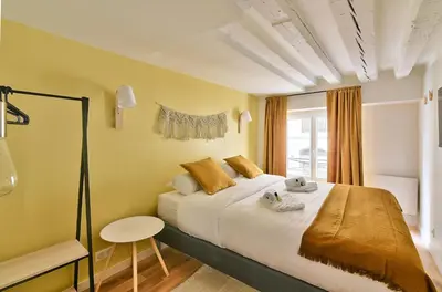Un ou plusieurs lits dans un hébergement de l'établissement GuestReady - Apt de charme - Jardin des Tuileries