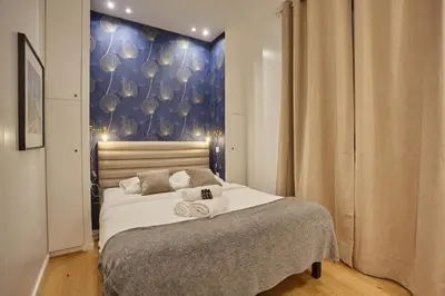 Un ou plusieurs lits dans un hébergement de l'établissement New Apartment 2 bedrooms center of Paris by Studio prestige