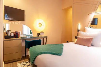 Un ou plusieurs lits dans un hébergement de l'établissement Hôtel Veryste & Spa Paris