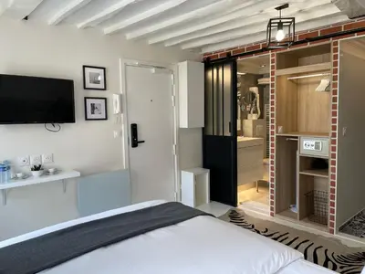 Un ou plusieurs lits dans un hébergement de l'établissement Studio Beaubourg Marais