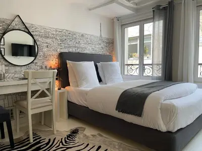 Un ou plusieurs lits dans un hébergement de l'établissement Studio Beaubourg Marais