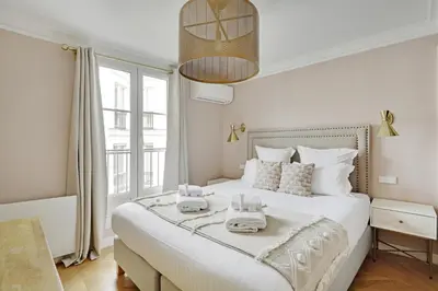 Un ou plusieurs lits dans un hébergement de l'établissement Pick A Flat's Apartments in Opéra Saint Lazarre - Rue de l'Isly