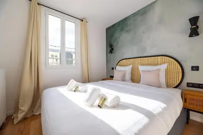 Un ou plusieurs lits dans un hébergement de l'établissement Vignature residence