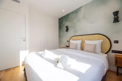 Un ou plusieurs lits dans un hébergement de l'établissement Vignature residence