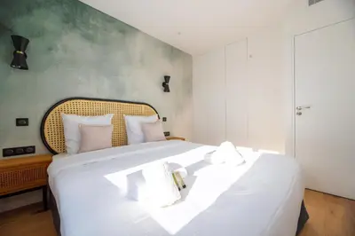 Un ou plusieurs lits dans un hébergement de l'établissement Vignature residence