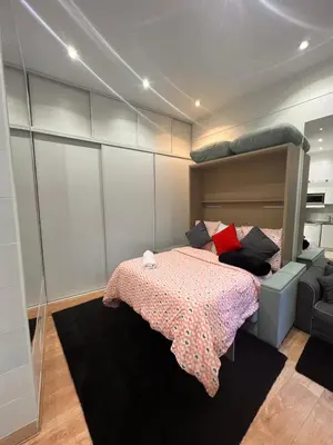 Un ou plusieurs lits dans un hébergement de l'établissement Chic Studio at Arc de Triomphe and Champs Elysees
