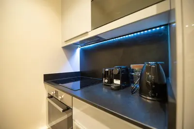 Cuisine ou kitchenette dans l'établissement MBM - LA TOUR