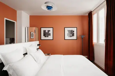 Un ou plusieurs lits dans un hébergement de l'établissement Edgar Suites Notre-Dame - Lagrange