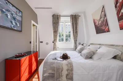Un ou plusieurs lits dans un hébergement de l'établissement L'Hôtel Particulier - Paris Asnières