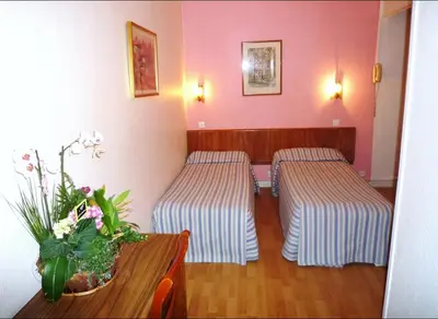 Un ou plusieurs lits dans un hébergement de l'établissement Hôtel Du Brabant