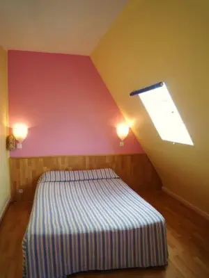 Un ou plusieurs lits dans un hébergement de l'établissement Hôtel Du Brabant