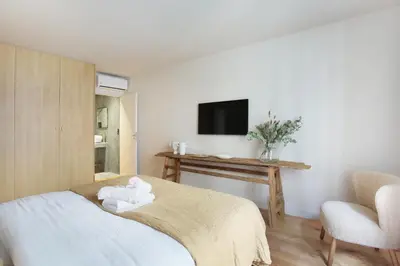 Un ou plusieurs lits dans un hébergement de l'établissement Residence in the center of Paris by Studio prestige