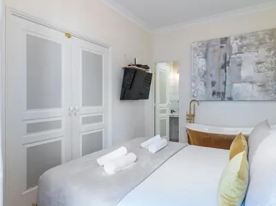 Un ou plusieurs lits dans un hébergement de l'établissement The Gatsby Suite