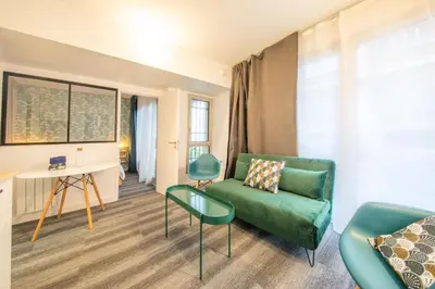 Coin salon dans l'établissement New Apt Near Bois de Vincennes - 2 Persons