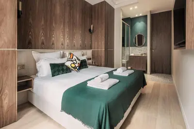Un ou plusieurs lits dans un hébergement de l'établissement HIGHSTAY - Luxury Serviced Apartments - North Marais 1