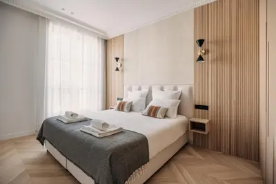 Un ou plusieurs lits dans un hébergement de l'établissement HIGHSTAY - Luxury Serviced Apartments - North Marais 1