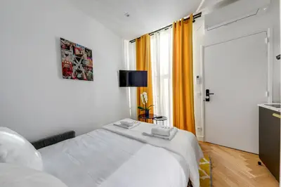 Un ou plusieurs lits dans un hébergement de l'établissement Suite CD : Superb Parisian apartment