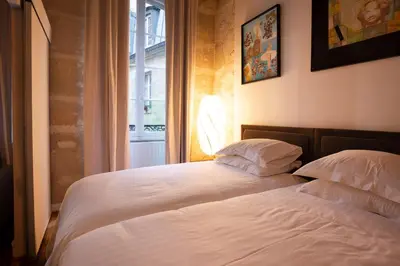 Un ou plusieurs lits dans un hébergement de l'établissement High Stay Saint Germain de Pres Paris 6