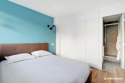 Un ou plusieurs lits dans un hébergement de l'établissement Cozy apartment - 1BR-4P - next to Paris