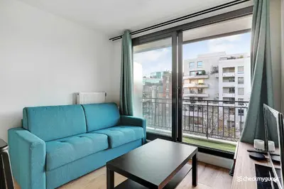 Coin salon dans l'établissement Cozy apartment - 1BR-4P - next to Paris
