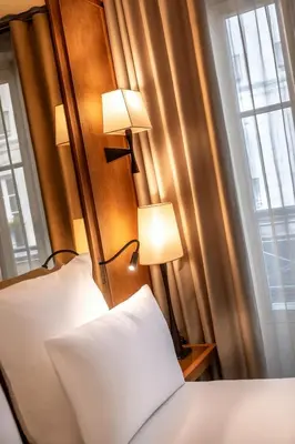 Un ou plusieurs lits dans un hébergement de l'établissement Hôtel Villa Madame - Saint-Germain-des-Prés