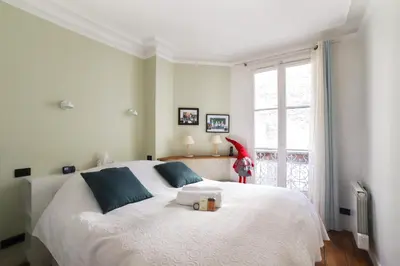 Un ou plusieurs lits dans un hébergement de l'établissement Appartement Duhesme - Welkeys