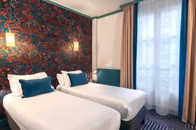 Un ou plusieurs lits dans un hébergement de l'établissement Hotel de Fleurie - Saint-Germain-des-Pres