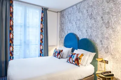 Un ou plusieurs lits dans un hébergement de l'établissement Hotel de Fleurie - Saint-Germain-des-Pres