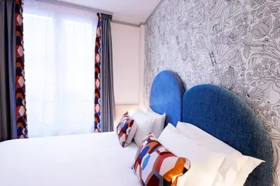 Un ou plusieurs lits dans un hébergement de l'établissement Hotel de Fleurie - Saint-Germain-des-Pres