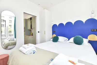 Un ou plusieurs lits dans un hébergement de l'établissement Charming and cosy flat next to the Eiffel Tower