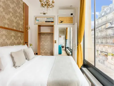 Un ou plusieurs lits dans un hébergement de l'établissement Merveil - Luxury Suite - Louvre - Reaumur II