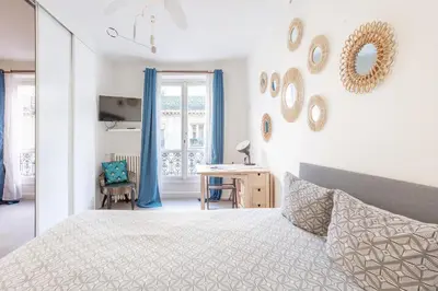Un ou plusieurs lits dans un hébergement de l'établissement Opéra Cozy Flat