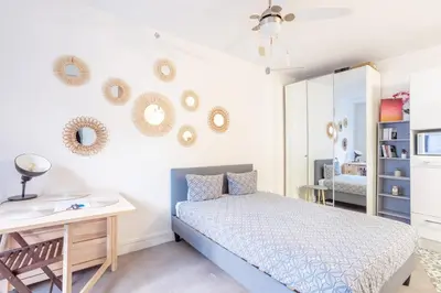 Un ou plusieurs lits dans un hébergement de l'établissement Opéra Cozy Flat