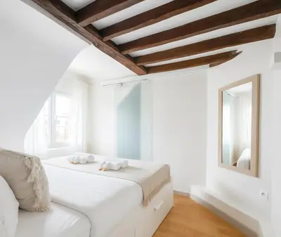 Un ou plusieurs lits dans un hébergement de l'établissement Opera - Deluxe apartment for 4